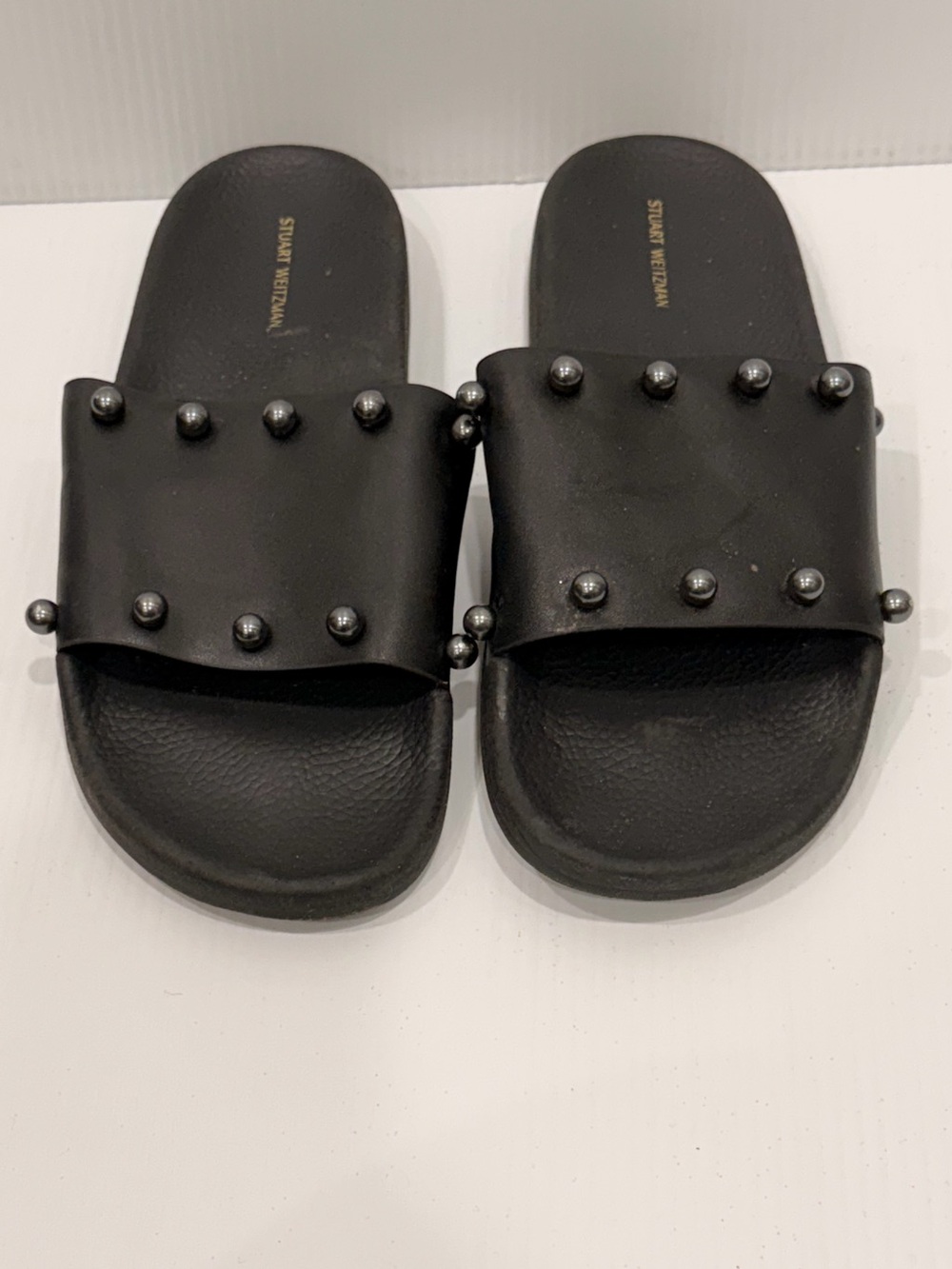 Stuart Weitzman Superstud Leather Slide Sandals.
